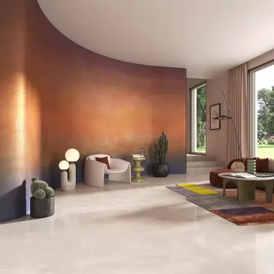 Soggiorno con pavimento in gres chiaro e parete curva color rame, in offerta